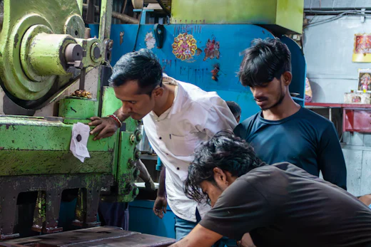 Machine operators running industrial machinery